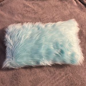 Fluffy turquoise pillow